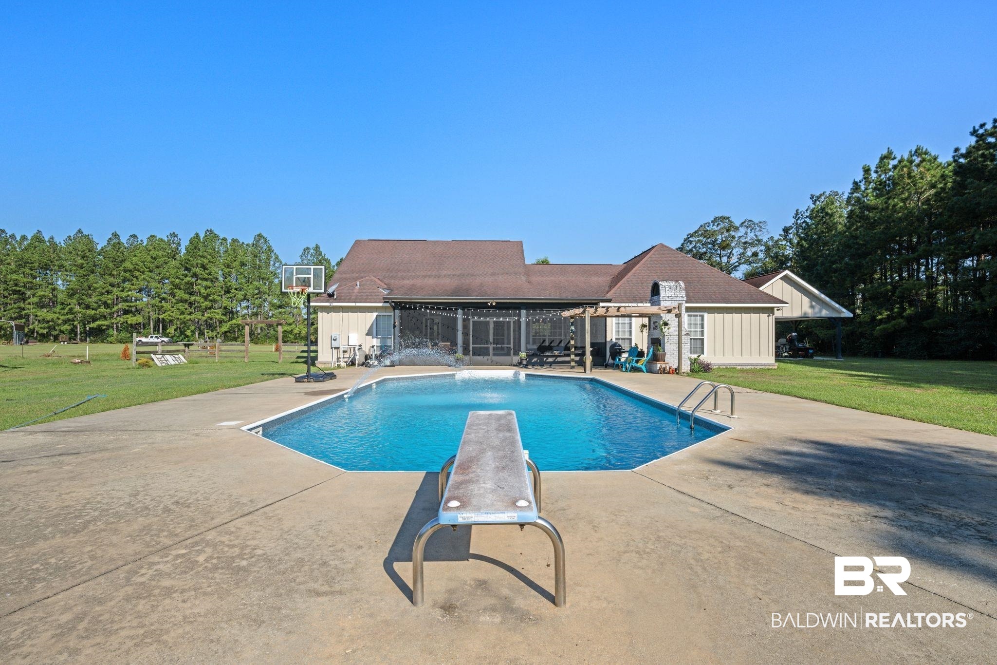 15635 North A N Brady Road Bay Minette, AL 36507 - Photo 38 of 51 View of swimming pool with a diving board, a yard, and a patio area