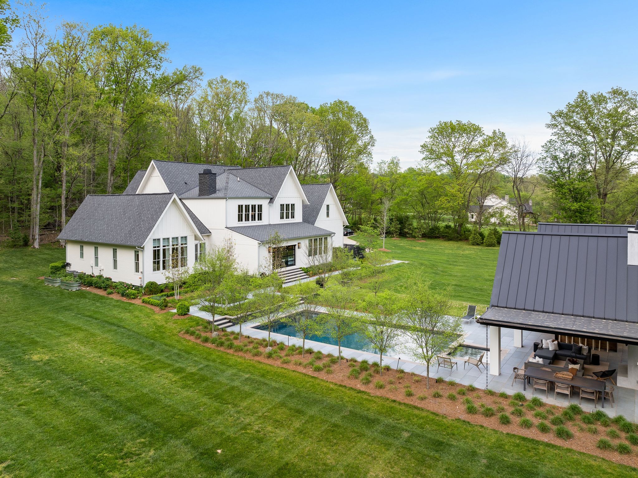 6475 Peytonsville-Arno Road College Grove, TN 37046 - Photo 53 of 70 a view of a house with backyard and a hammock