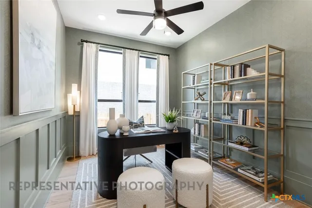 a reading room with furniture a window and a chandelier