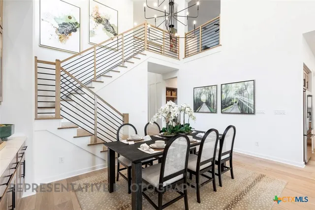a view of a dining room with furniture and window