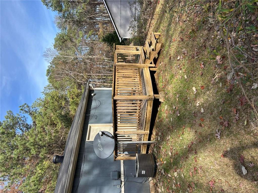 1292-4 Crystal Lake Road College Park, GA 30349 - Photo 2 of 2 a view of a backyard with a small trees