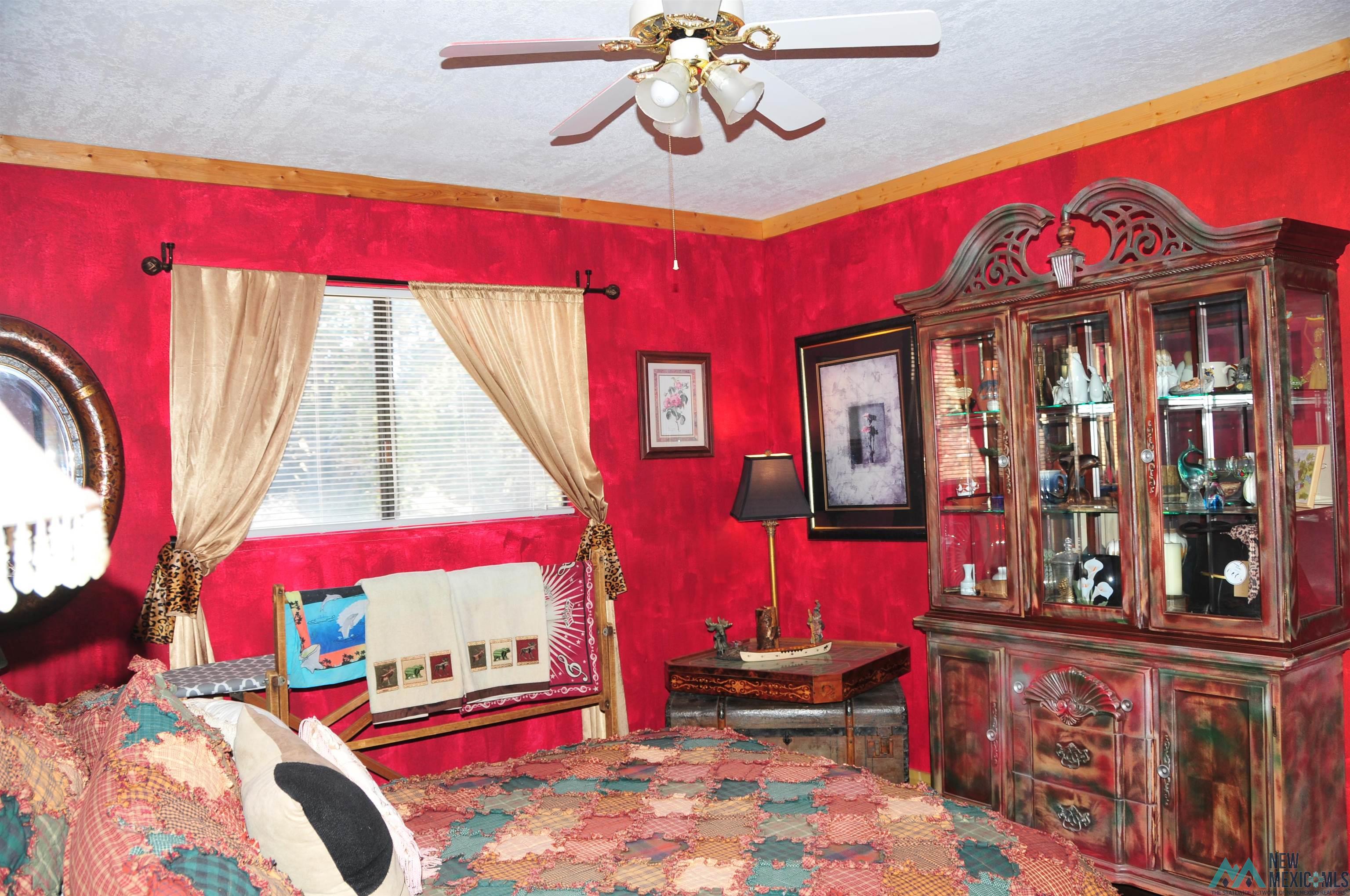 25 Bluff Road Thoreau, NM 87323 - Photo 17 of 31 Room featuring a window with blinds, ceiling fan, and decorative trim