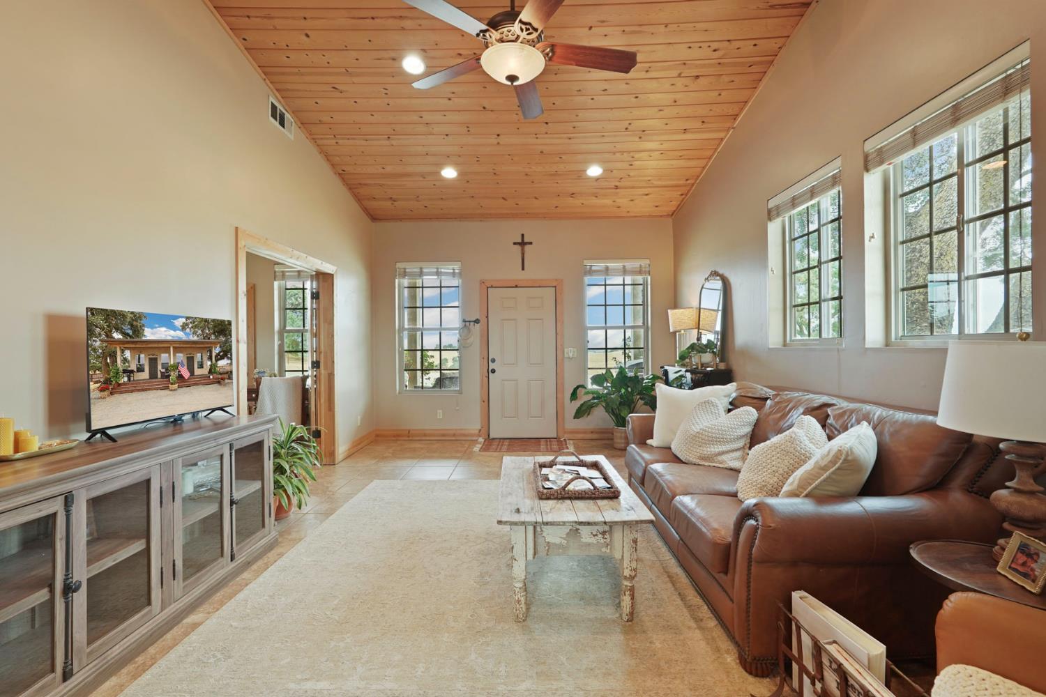 21754 North Cord Road Clements, CA 95227 - Photo 14 of 60 a living room with furniture and a flat screen tv