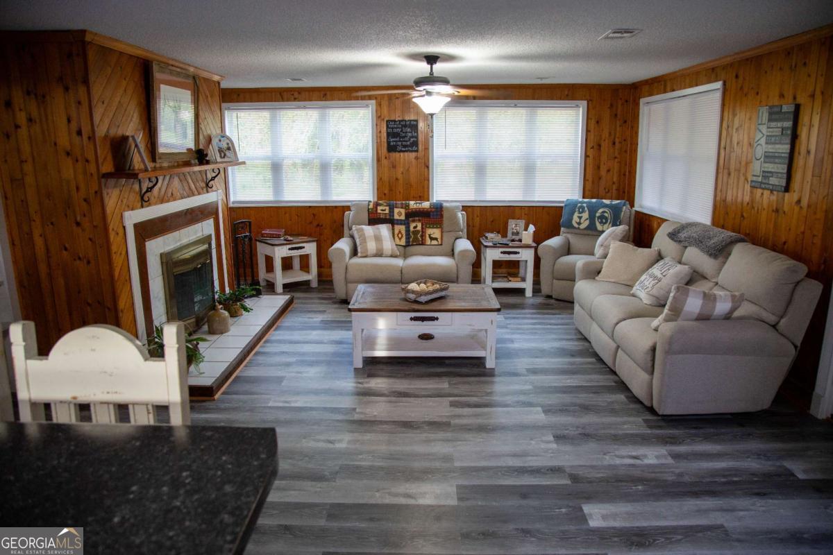 1758 Easons Bluff Road Baxley, GA 31513 - Photo 12 of 50 a living room with furniture and a fireplace