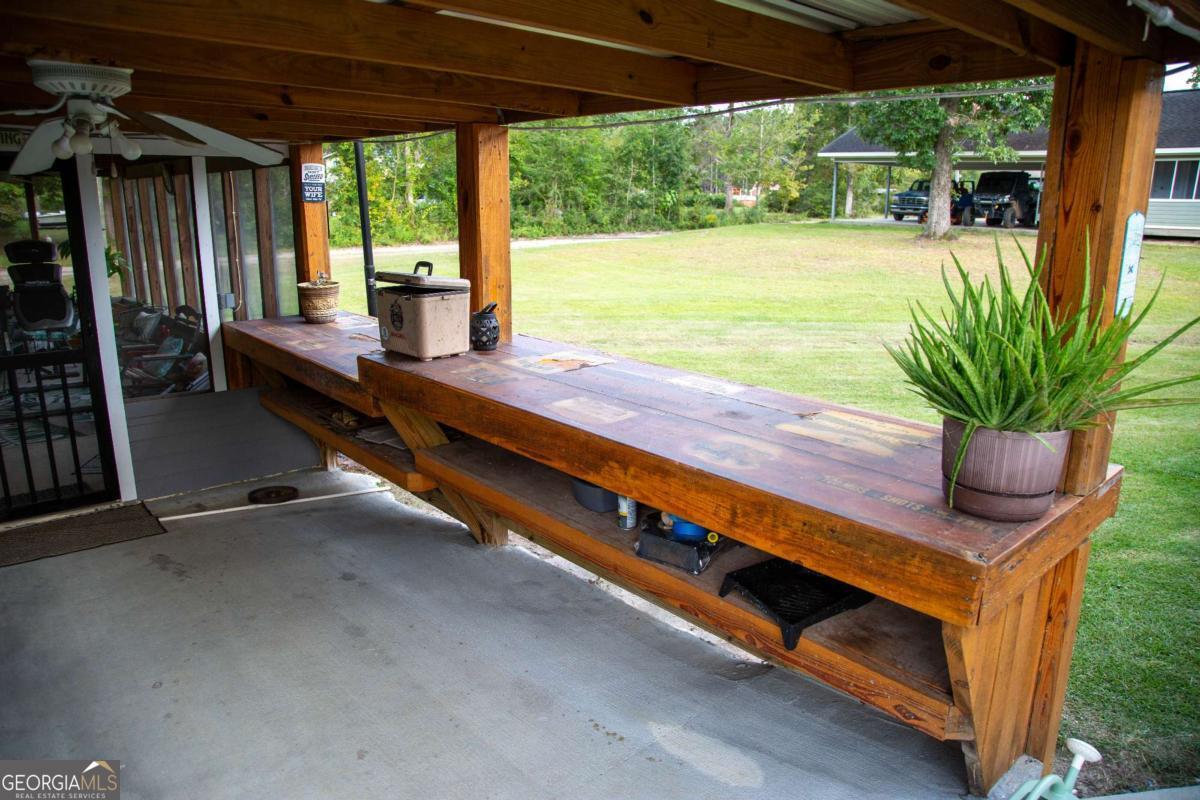 1758 Easons Bluff Road Baxley, GA 31513 - Photo 21 of 50 a outdoor space with pool and outdoor seating