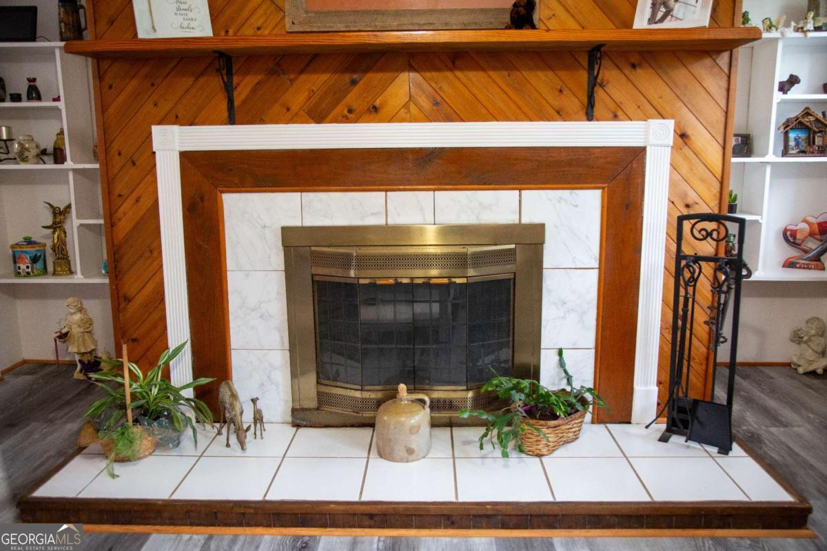 1758 Easons Bluff Road Baxley, GA 31513 - Photo 27 of 50 a fireplace with potted plant in front of it