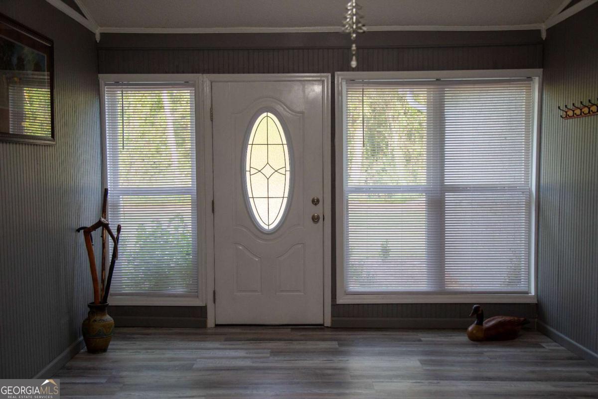 1758 Easons Bluff Road Baxley, GA 31513 - Photo 29 of 50 a view of a livingroom with wooden floor and a window