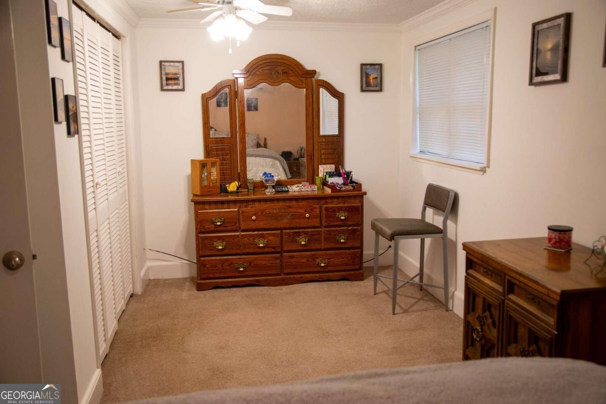 1758 Easons Bluff Road Baxley, GA 31513 - Photo 35 of 50 a room with furniture and mirror