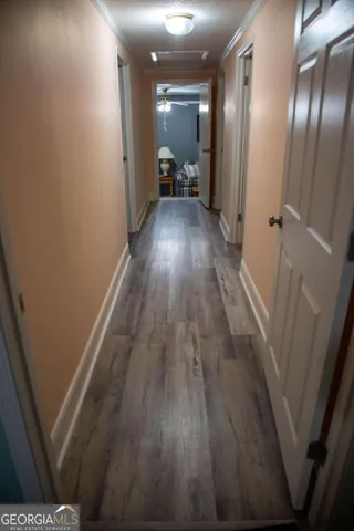 a bedroom with a bed and a night stand