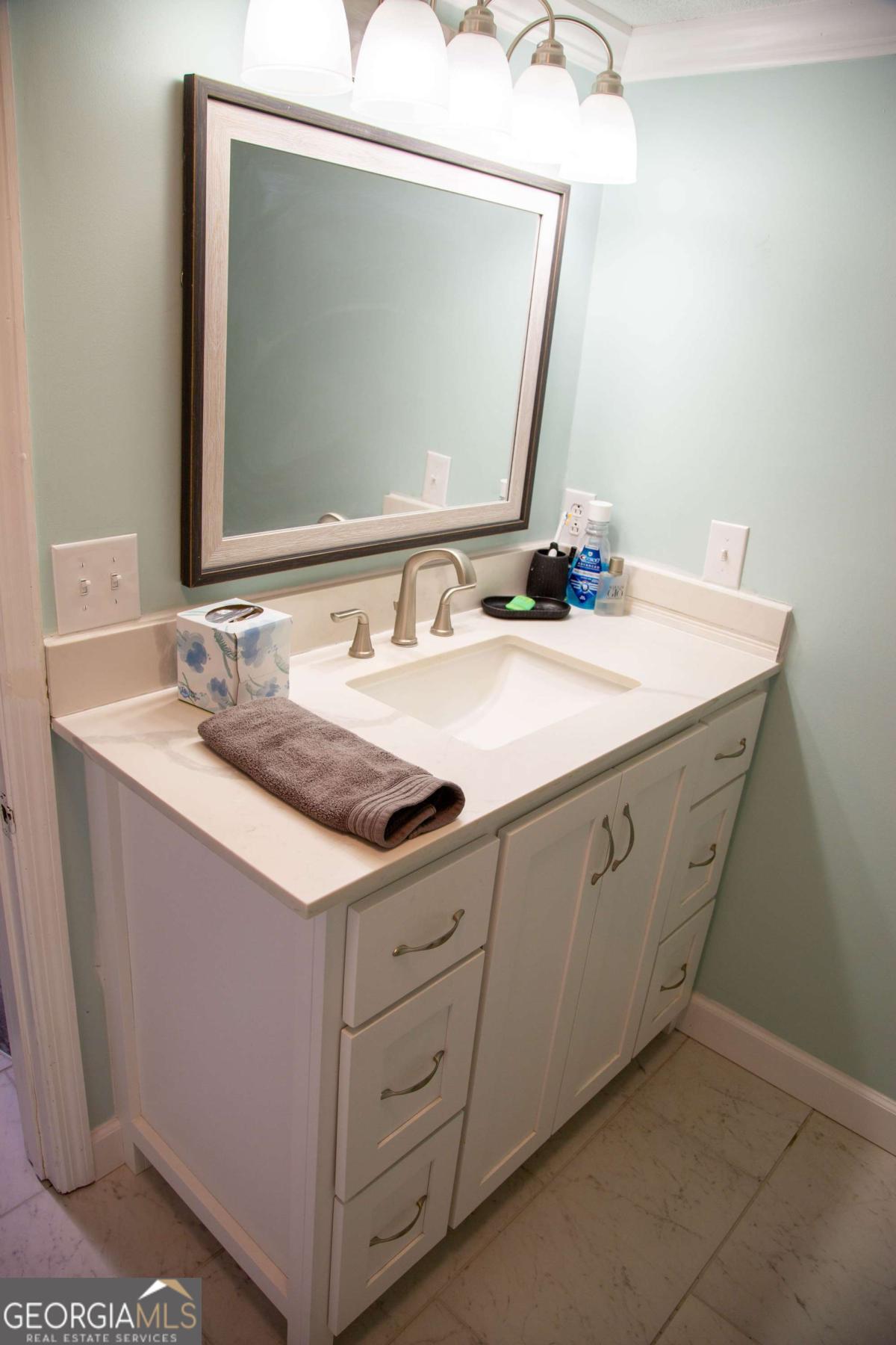 1758 Easons Bluff Road Baxley, GA 31513 - Photo 40 of 50 a bathroom with a sink vanity and a mirror