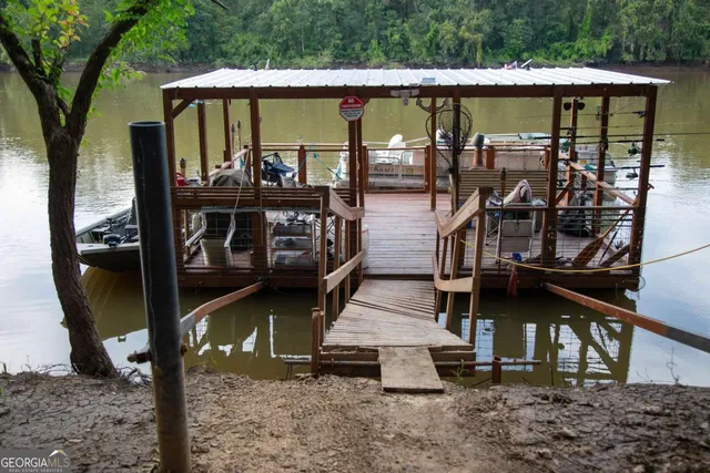 a view of swimming pool with seating area