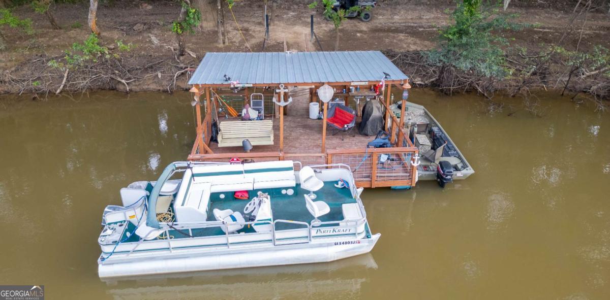 1758 Easons Bluff Road Baxley, GA 31513 - Photo 42 of 50 a view of table and chairs in patio