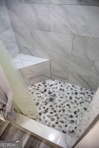 a view of swimming pool with a garden and plants