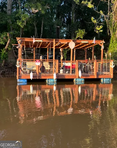 a view of swimming pool with outdoor seating