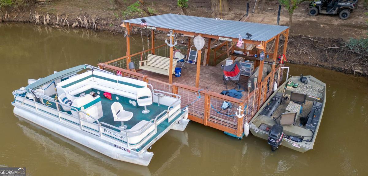 1758 Easons Bluff Road Baxley, GA 31513 - Photo 6 of 50 an outdoor sitting area with chairs