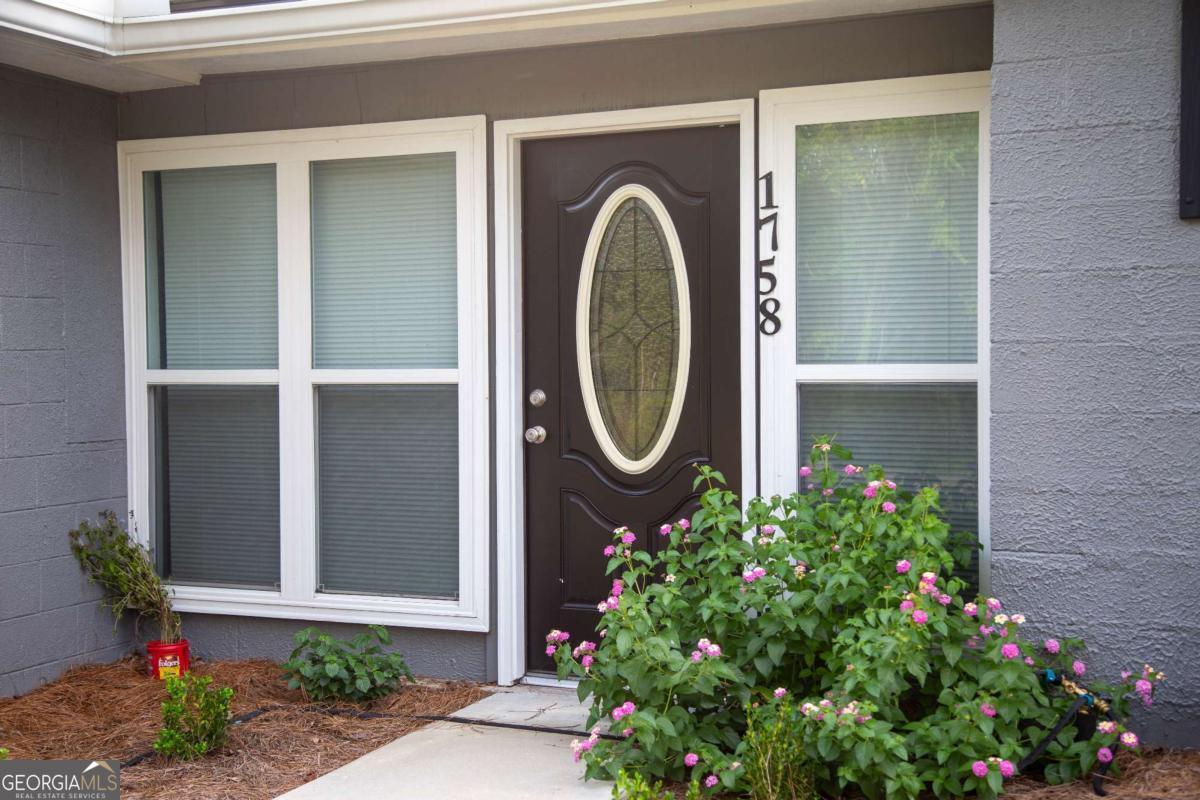 1758 Easons Bluff Road Baxley, GA 31513 - Photo 10 of 50 a front view of a house with a garden