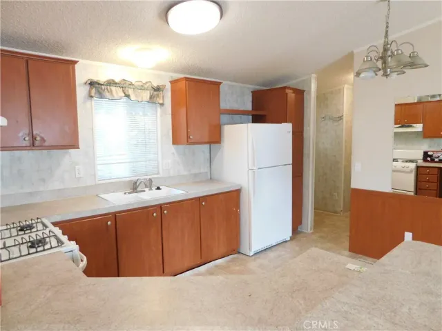 a kitchen with sink a cabinets and window