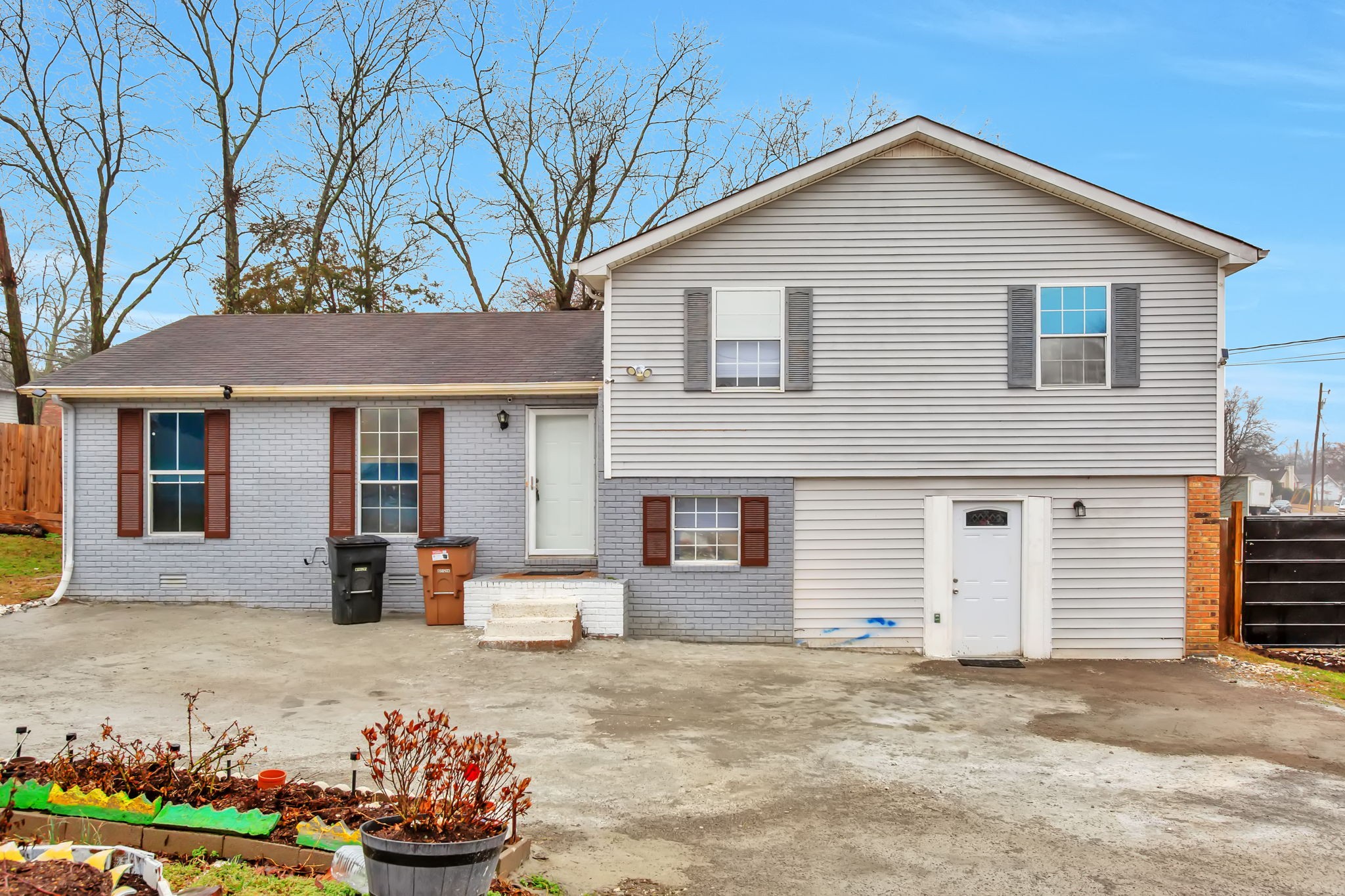 3296 Anderson Road Antioch, TN 37013 - Photo 2 of 25 a front view of a house with a yard and seating space