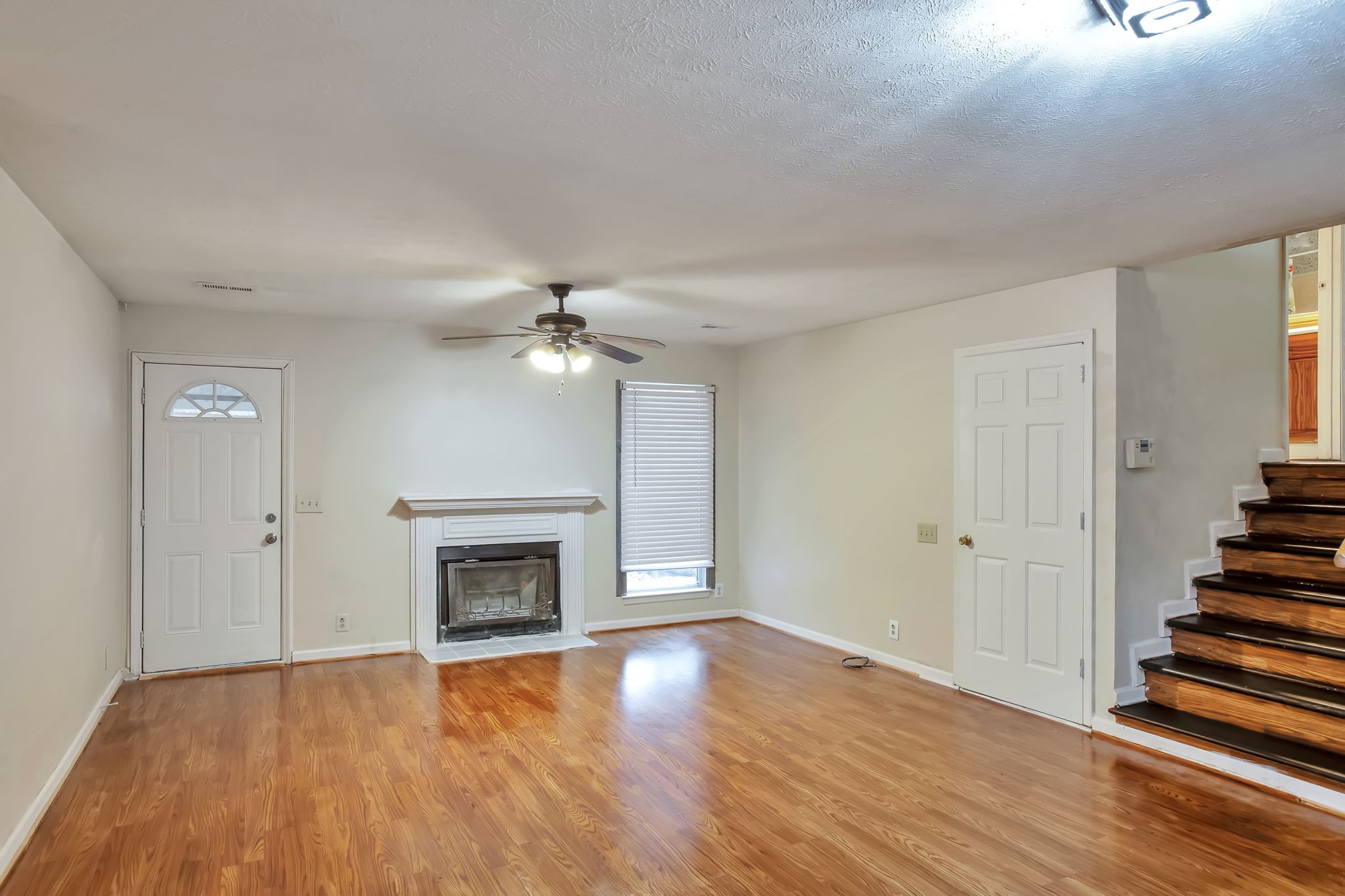 3296 Anderson Road Antioch, TN 37013 - Photo 3 of 25 wooden floor fireplace and natural light in room