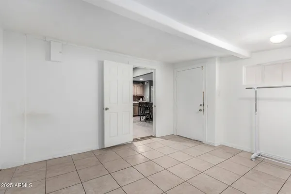 a view of an empty room and closet