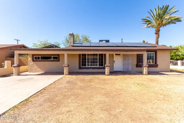 front view of a house with a yard