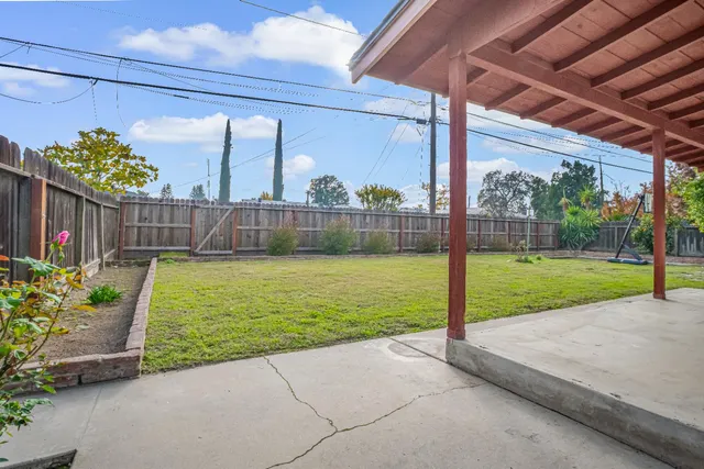 a view of a backyard with a garden and plants