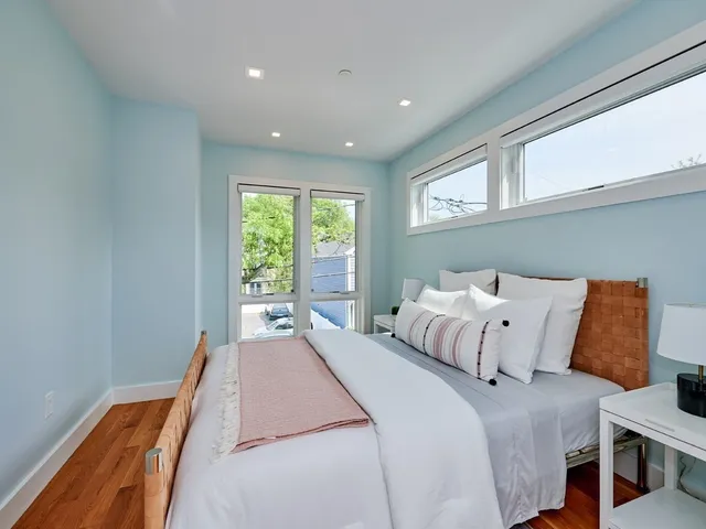 a bedroom with bed and window