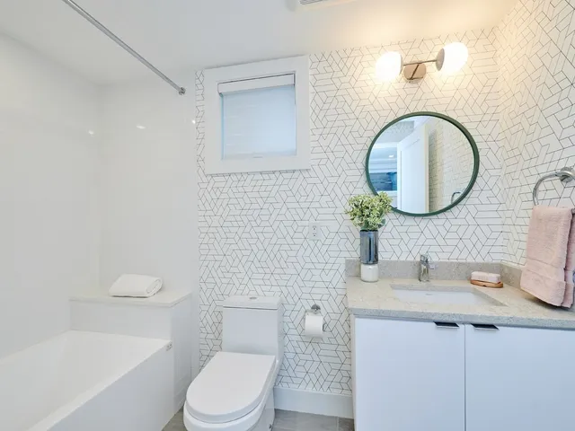a bathroom with a bathtub and a shower