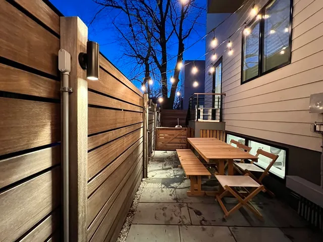 a view of two chairs in the balcony