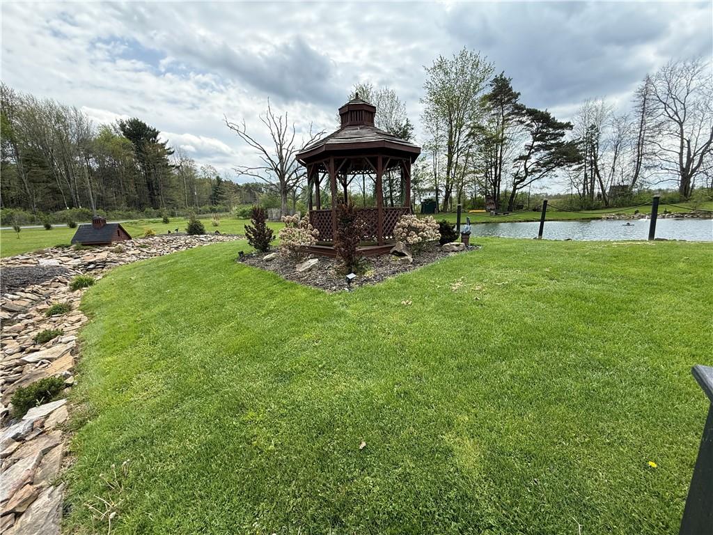 1417 Pine Flats Road Clymer, PA 15728 - Photo 6 of 22 a view of a garden with a bench in a garden