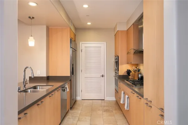 a kitchen with sink cabinets and stove