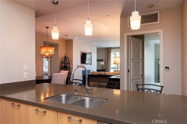 a view of a kitchen counter space and a living room