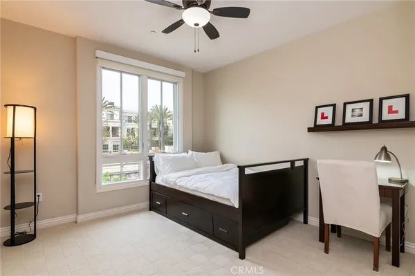 a bed room with a bed and a window