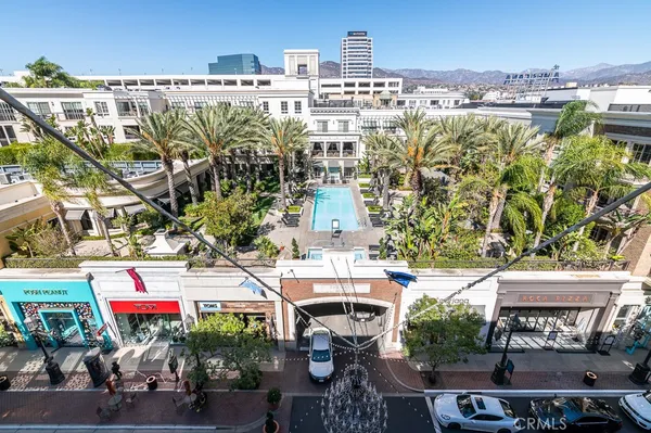a view of a patio with dining table and chairs and a fire pit