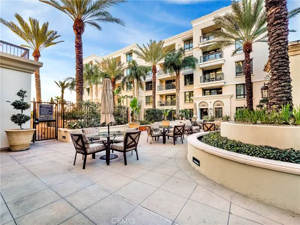 a front view of a building with a garden