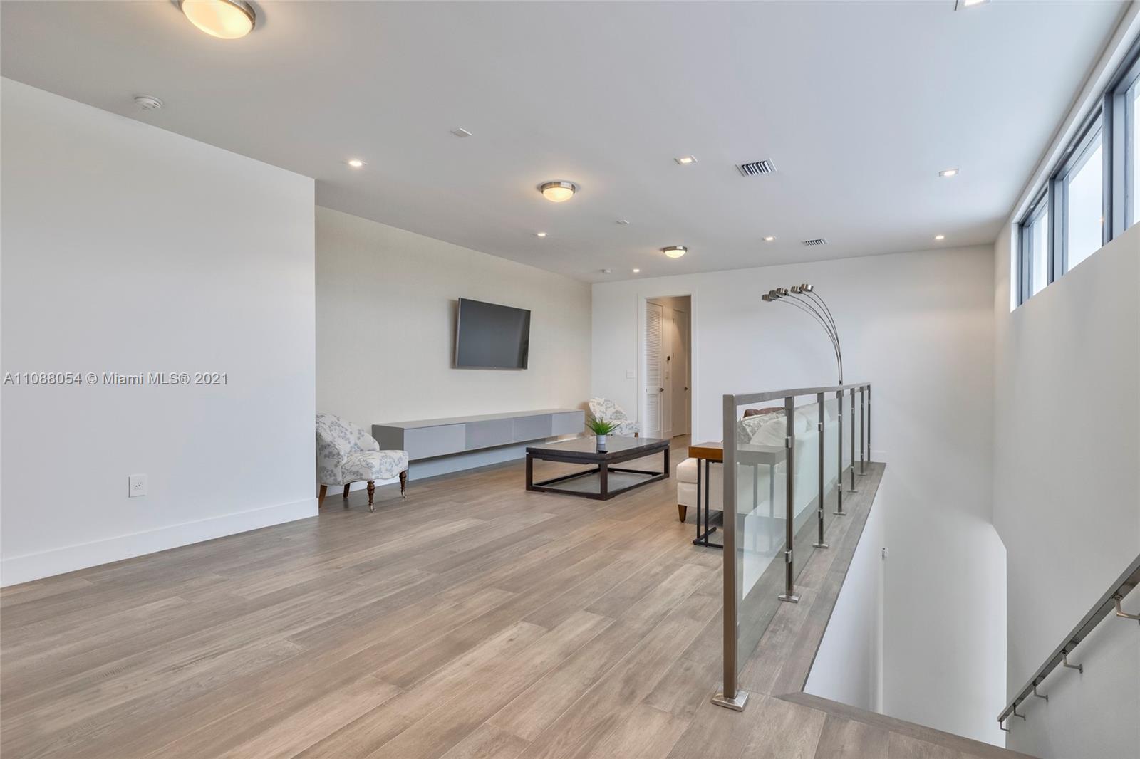 16610 Sunset Way Weston, FL 33326 - Photo 21 of 35 a view of a living room and entryway