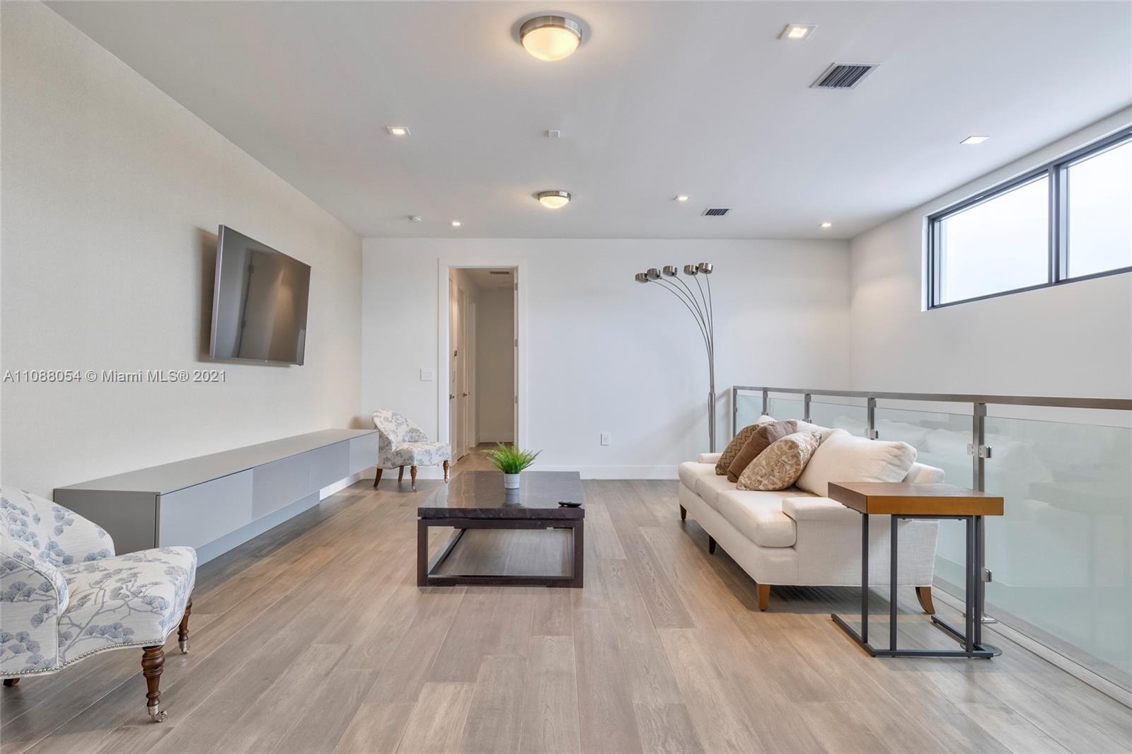 16610 Sunset Way Weston, FL 33326 - Photo 22 of 35 a living room with furniture and a wooden floor