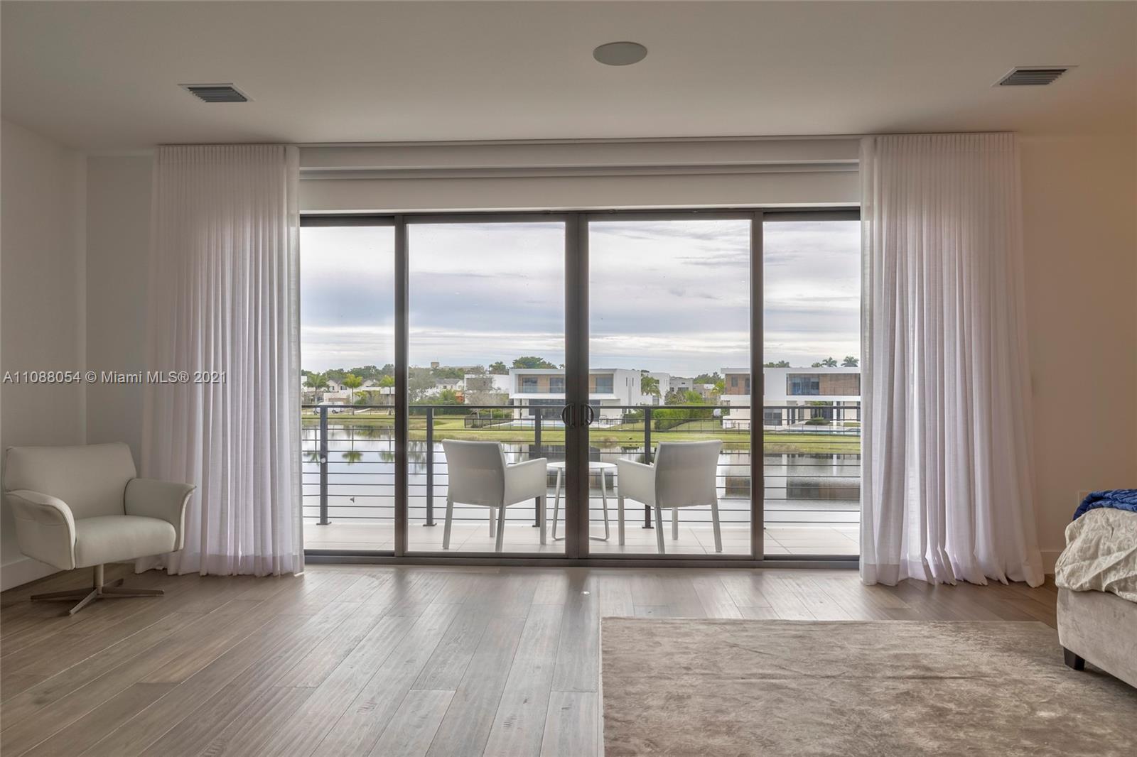 16610 Sunset Way Weston, FL 33326 - Photo 33 of 35 a view of livingroom with furniture and floor to ceiling window