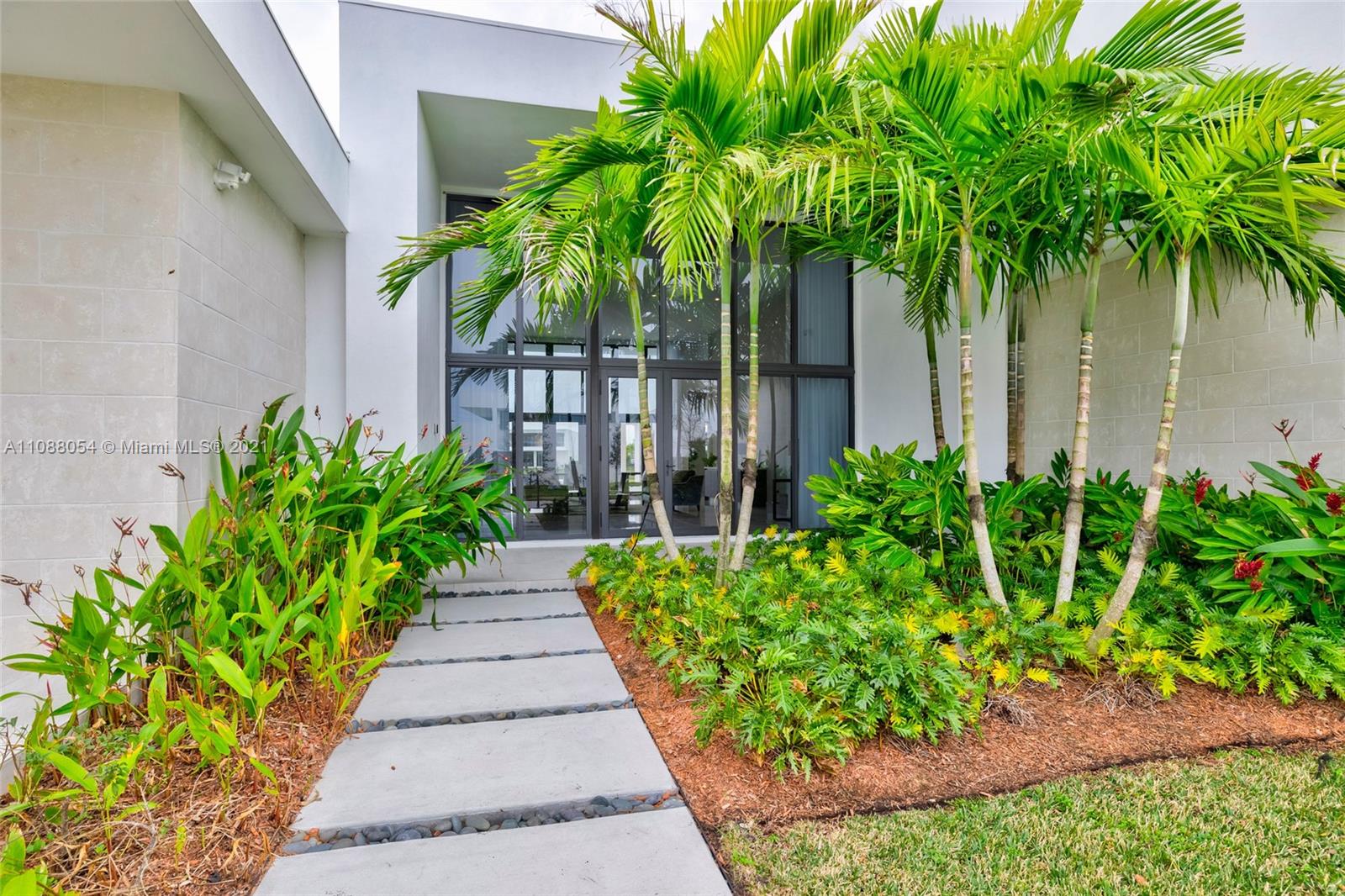 16610 Sunset Way Weston, FL 33326 - Photo 5 of 35 a view of a garden with a pathway