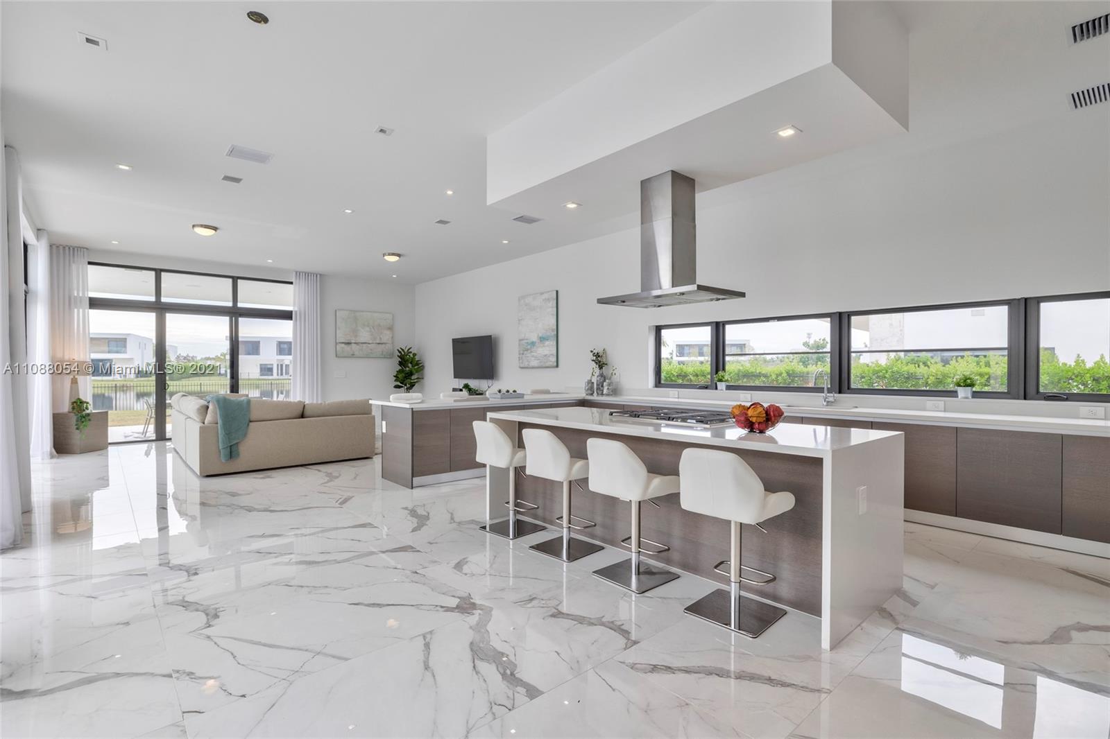 16610 Sunset Way Weston, FL 33326 - Photo 9 of 35 a living room with furniture and a large window