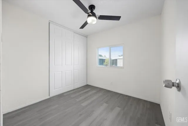 a view of an house with backyard and sitting area