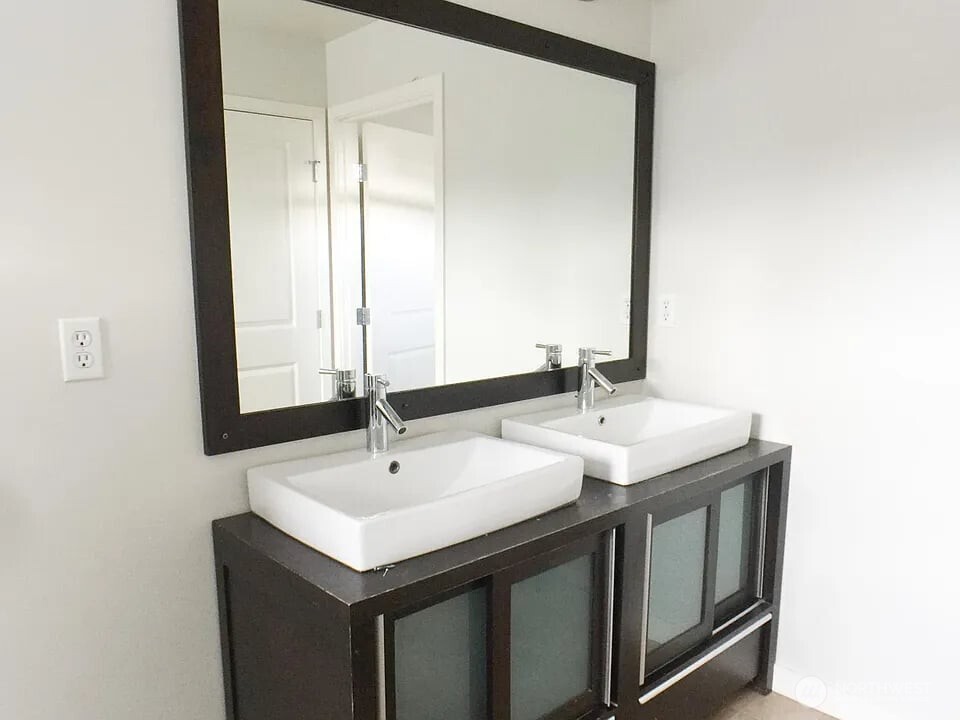 1329 159th Street Southwest Lynnwood, WA 98087 - Photo 8 of 10 a bathroom with a sink and a mirror