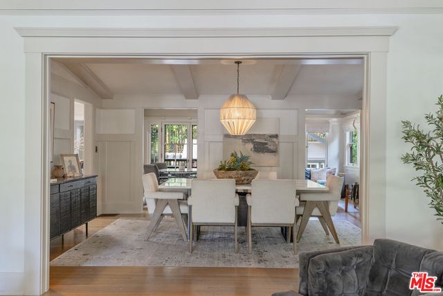 a living room with furniture and large windows