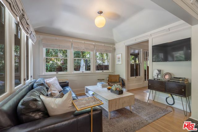 a kitchen with a table chairs sink and cabinets
