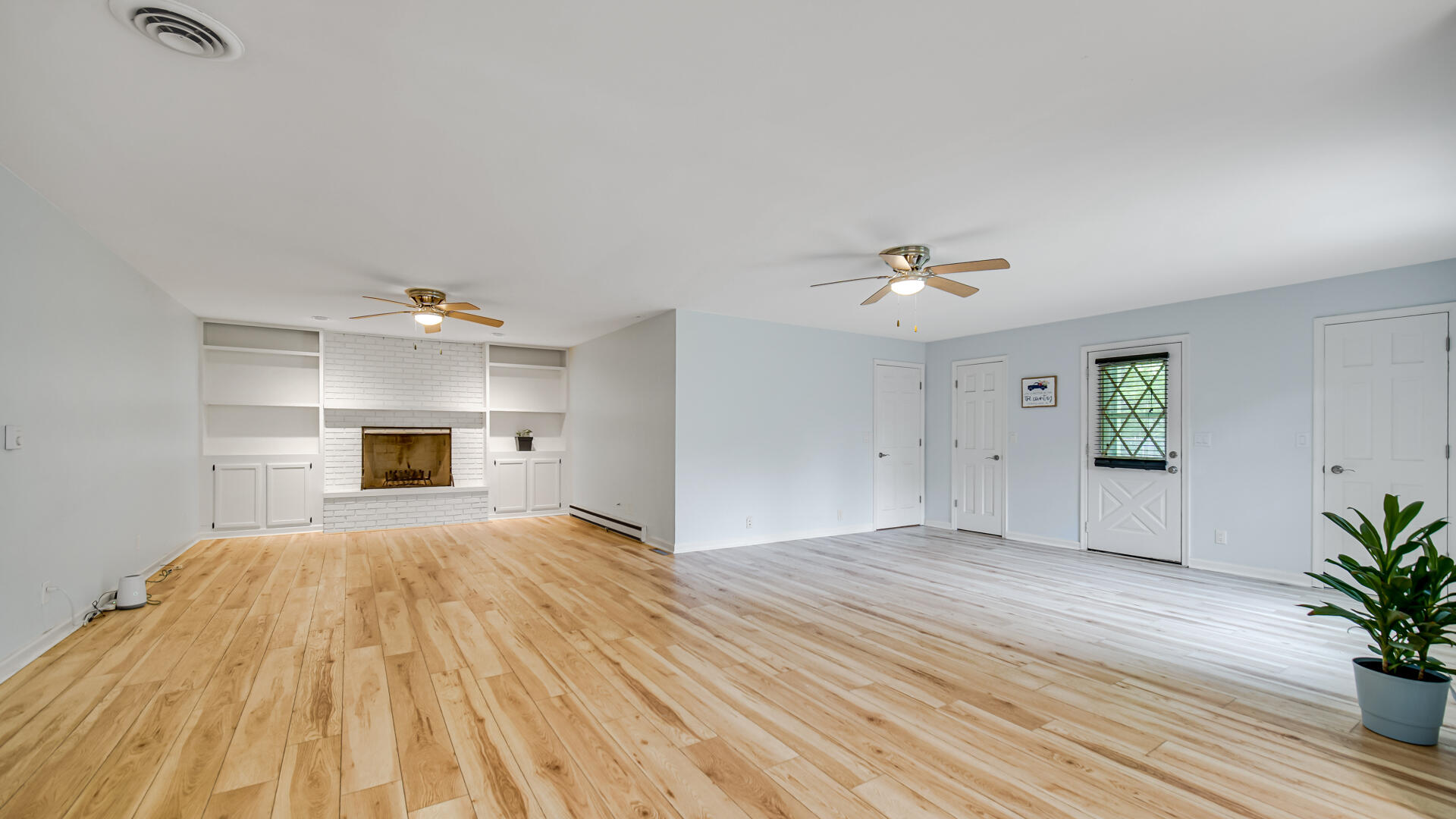 6717 State Rte 49 Rensselaer, IN 47978 - Photo 13 of 31 a view of empty room with wooden floor and fan