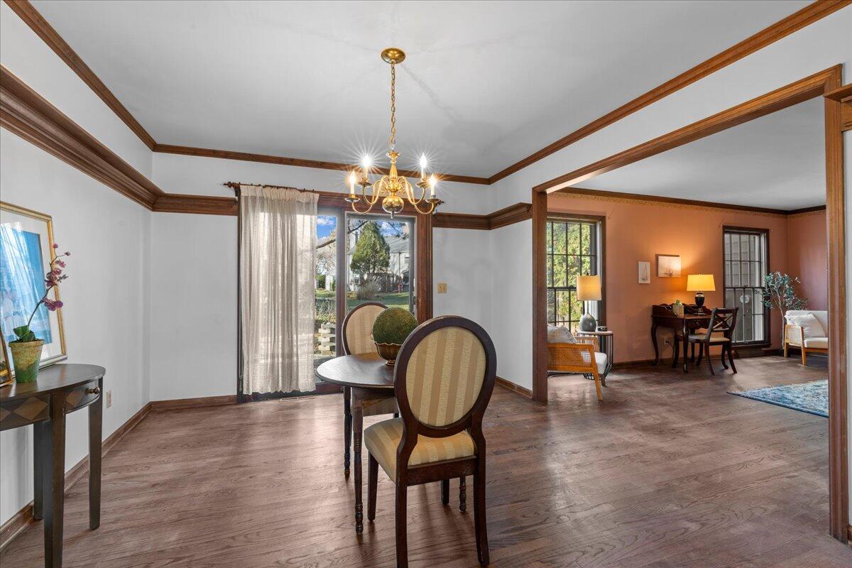 1012 West Cedar Ridge Court Mequon, WI 53092 - Photo 7 of 36 Hardwood floors, crown moldings, and access to the patio.