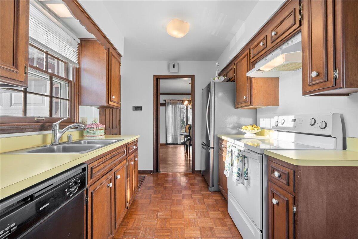1012 West Cedar Ridge Court Mequon, WI 53092 - Photo 10 of 36 Parquet hardwood floors, pantry and utility closet.