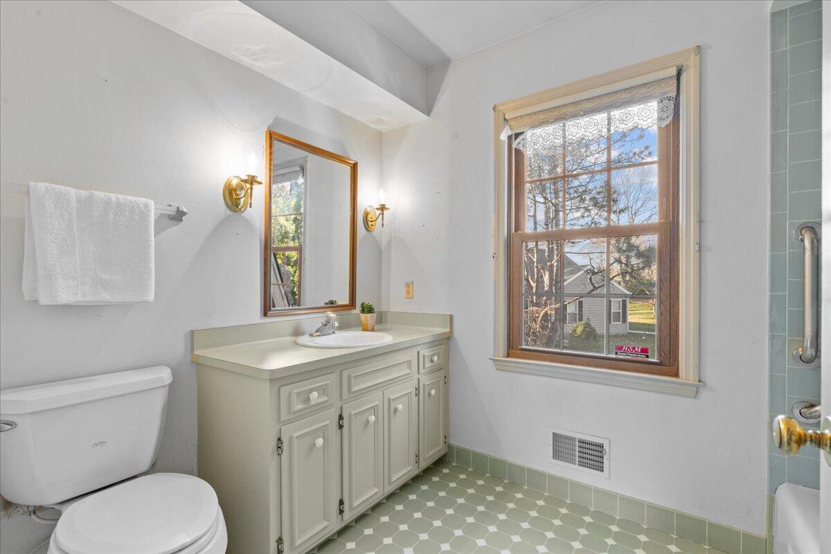 1012 West Cedar Ridge Court Mequon, WI 53092 - Photo 24 of 36 Ceramic tile, vanity and shower over tub.