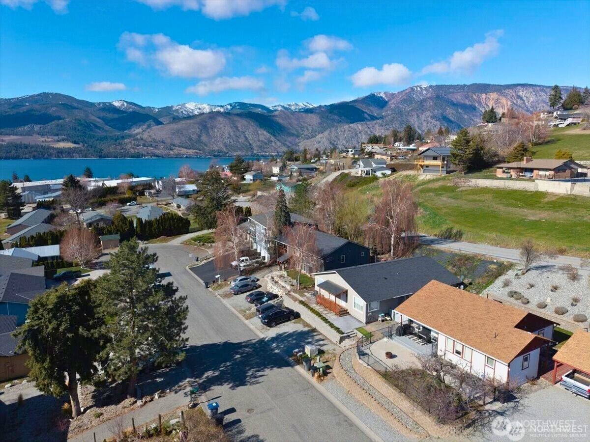 380 North Shore Court Manson, WA 98831 - Photo 1 of 27 an aerial view of a house with mountain view
