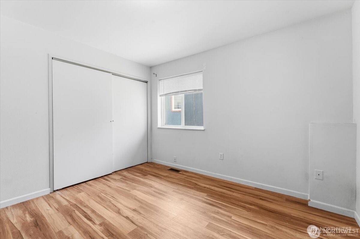 380 North Shore Court Manson, WA 98831 - Photo 18 of 27 a view of empty room with wooden floor